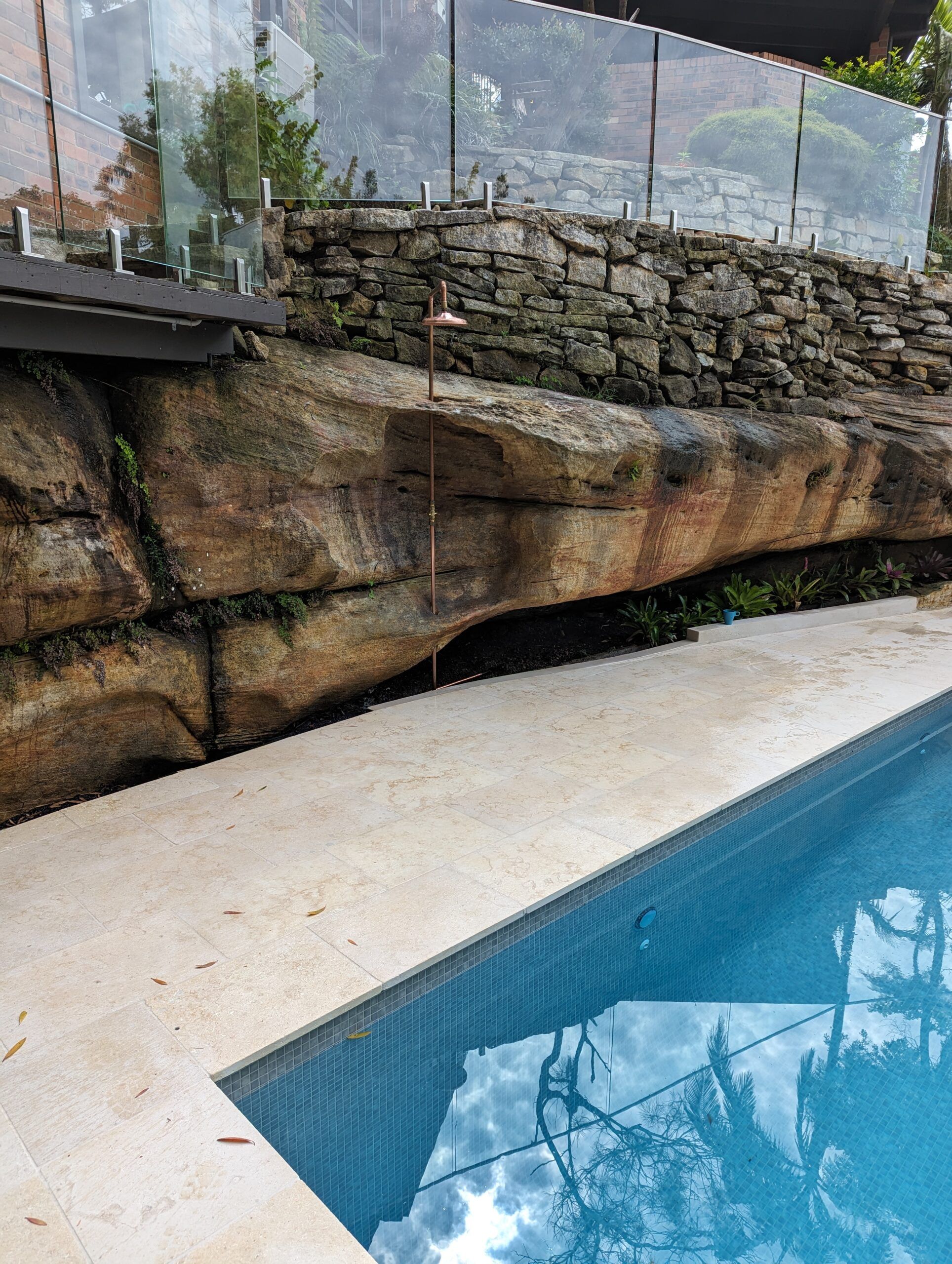 Outdoor shower beside pool in Frenchs Forest